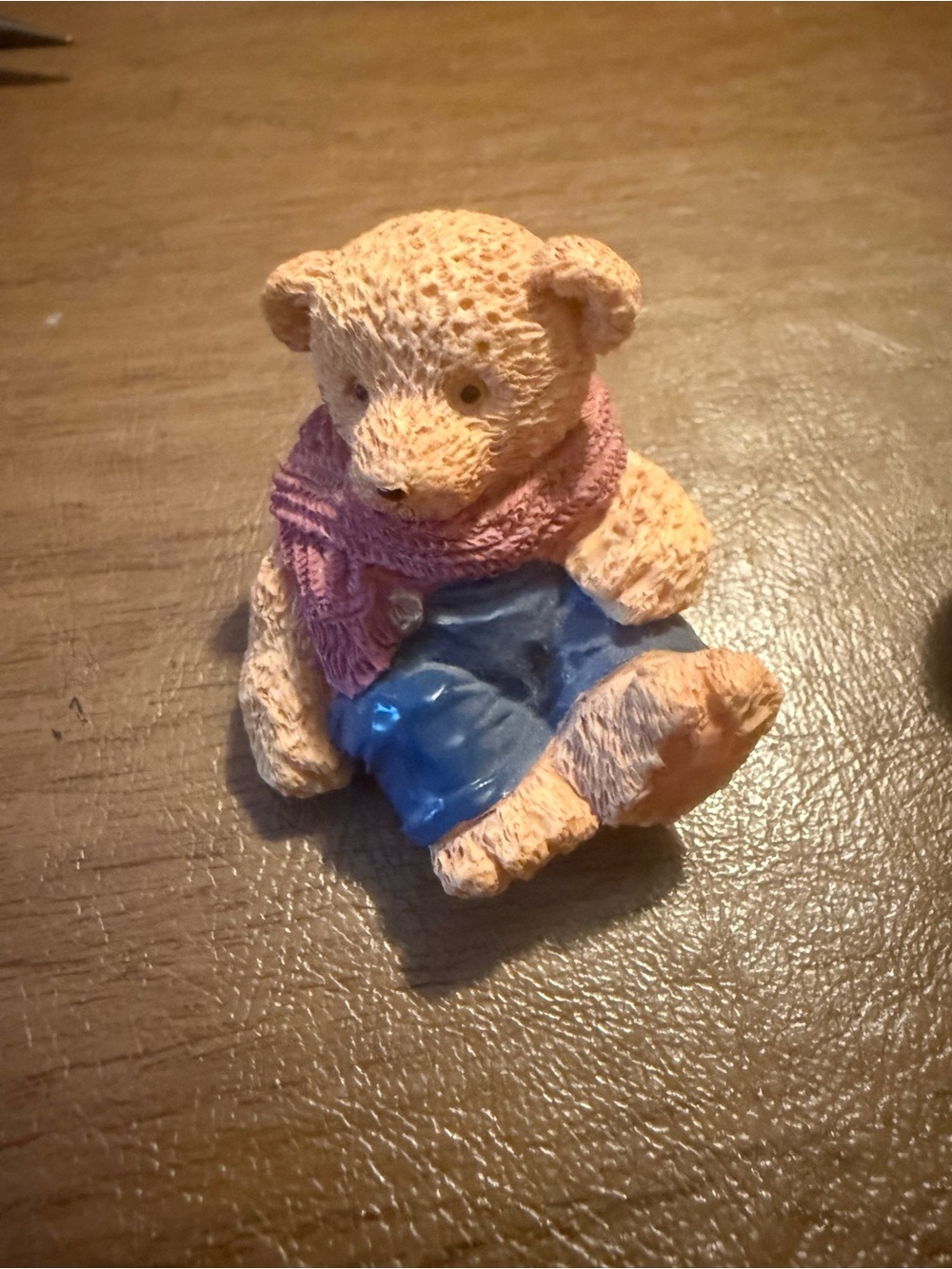 Vintage 1994 J.C. miniature teddy bear figurine, blue overalls & a pink scarf.